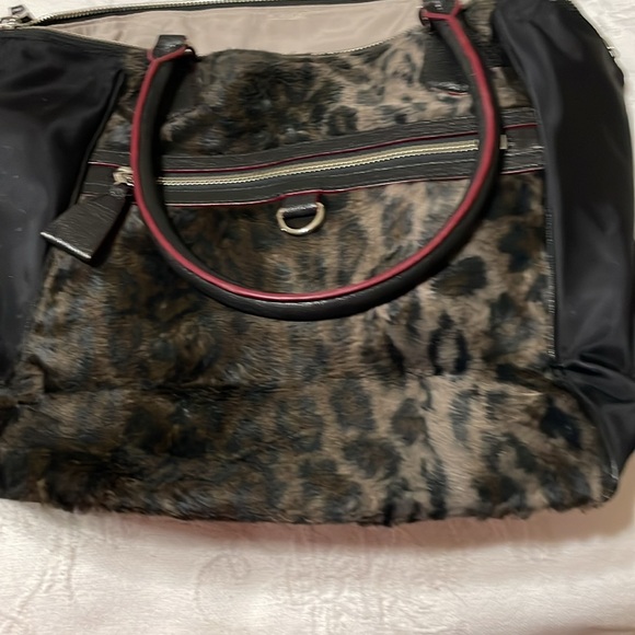 Leopard print with the feel of fur.MZ Wallace purse.Red trim with black handles. - Picture 7 of 7